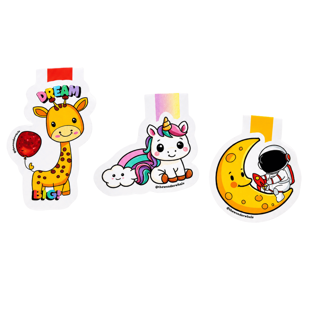 Collection of three cute magnetic bookmarks featuring a cheerful giraffe with the words "Dream Big," a smiling unicorn with a rainbow and cloud, and an astronaut sitting on a crescent moon holding a rocket.