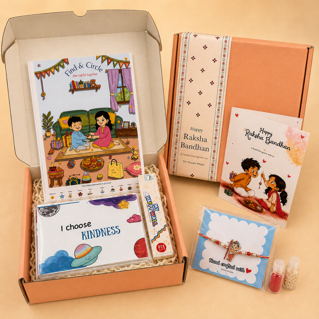 A curated gift box set displayed on a warm beige background, featuring an open peach-colored box filled with children's books, a card, and a bracelet, alongside a closed matching box and two small decorative packets.