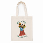 tote bag with design of a woman with flowers quoted "bagging big dreams"